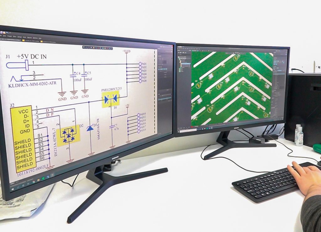 A PCB designer uses CAD software